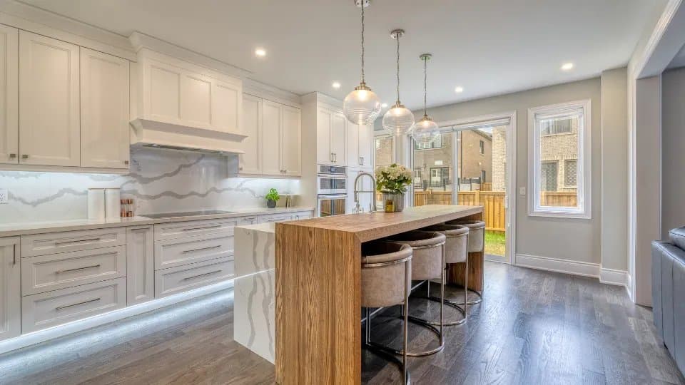 Modern kitchen renovation with warm wood cabinets and quartzite countertops in a Lehigh Valley Pennsylvania home